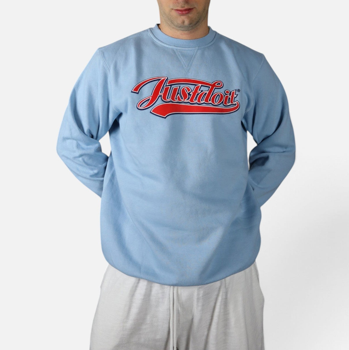 Vintage 2000s Nike Just Do It crewneck, baby blue, worn