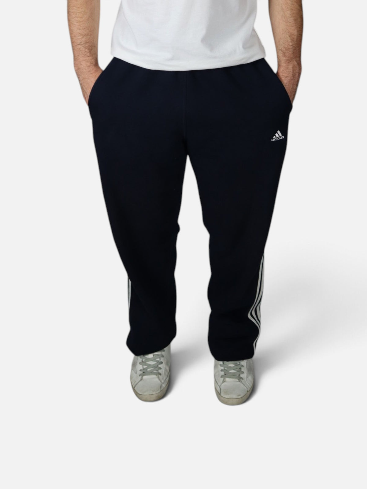Vintage 2000s Adidas three stripe sweatpants, navy, worn front