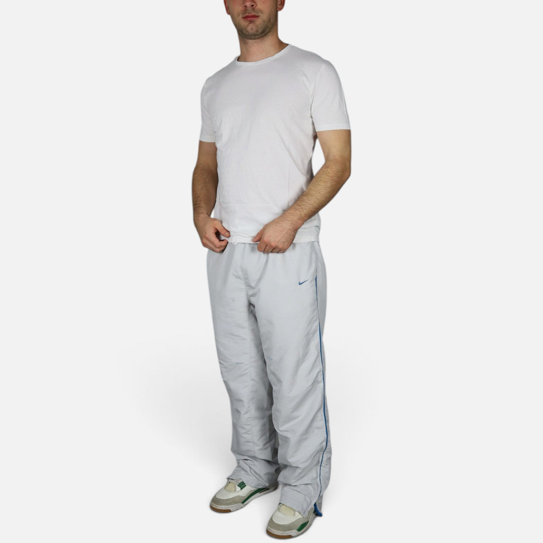 2000s Nike trackpants in light grey with blue details — worn