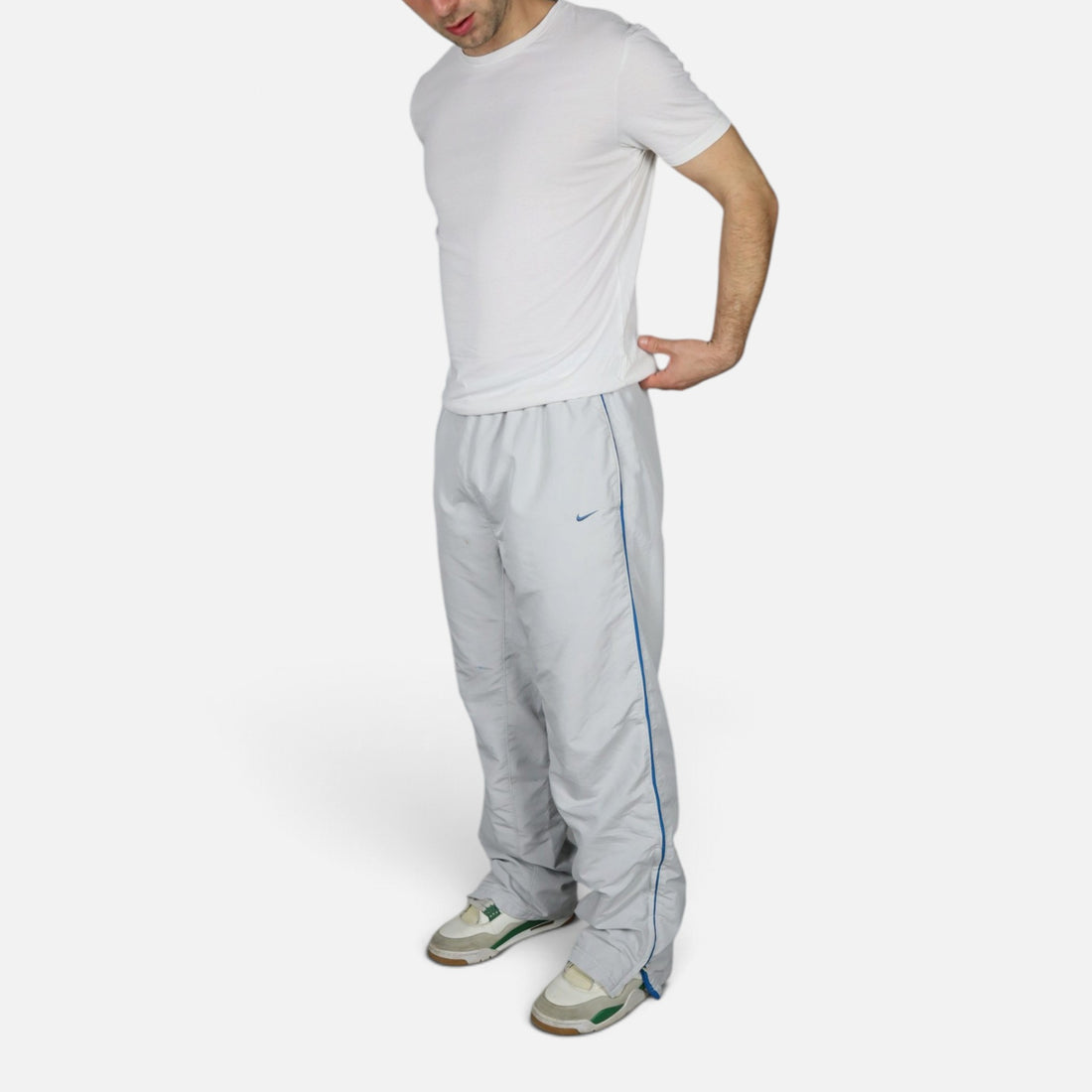 2000s Nike trackpants in light grey with blue details — worn