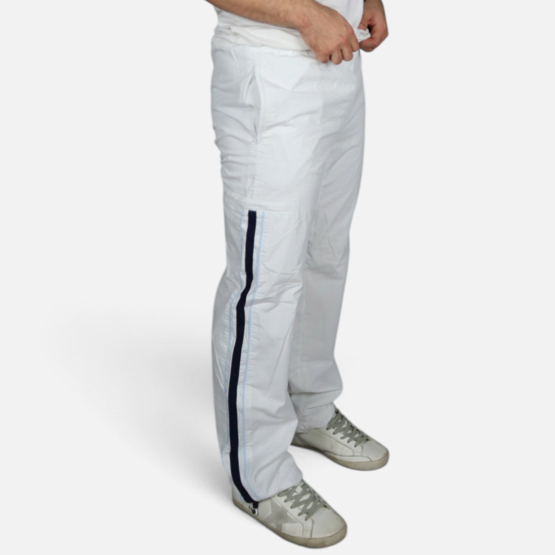 Y2K Nike trackpants in white with navy stripes — worn