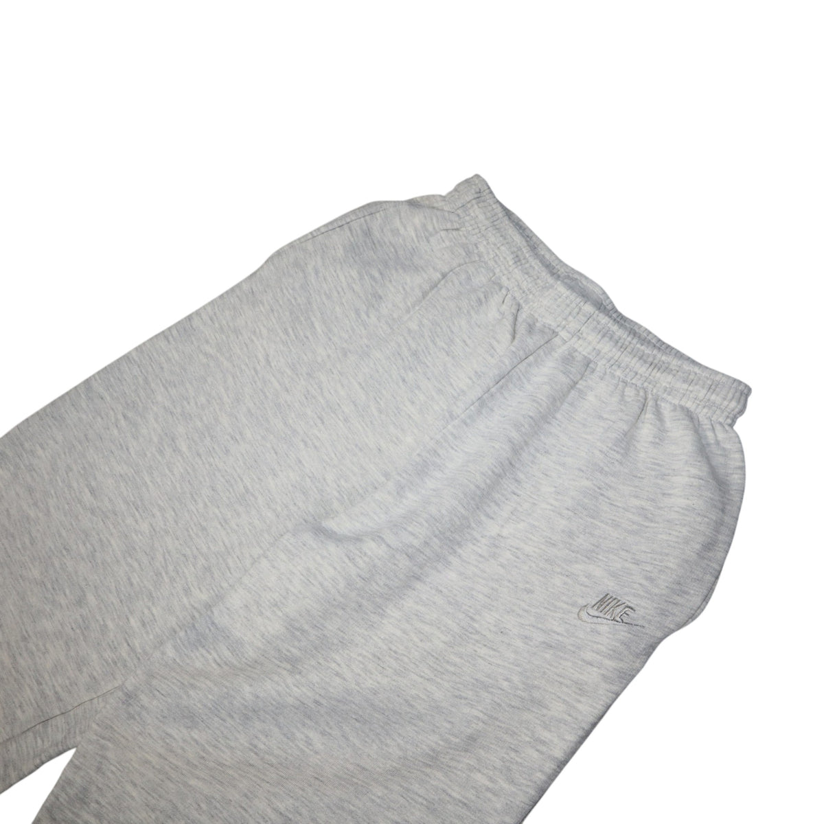 Early 90s Nike baggy sweatpants in grey marl, made in Greece — flat lay