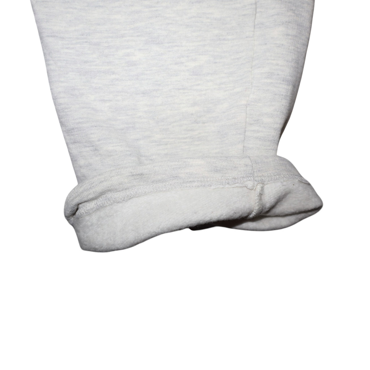 Early 90s Nike baggy sweatpants in grey marl, made in Greece — flat lay