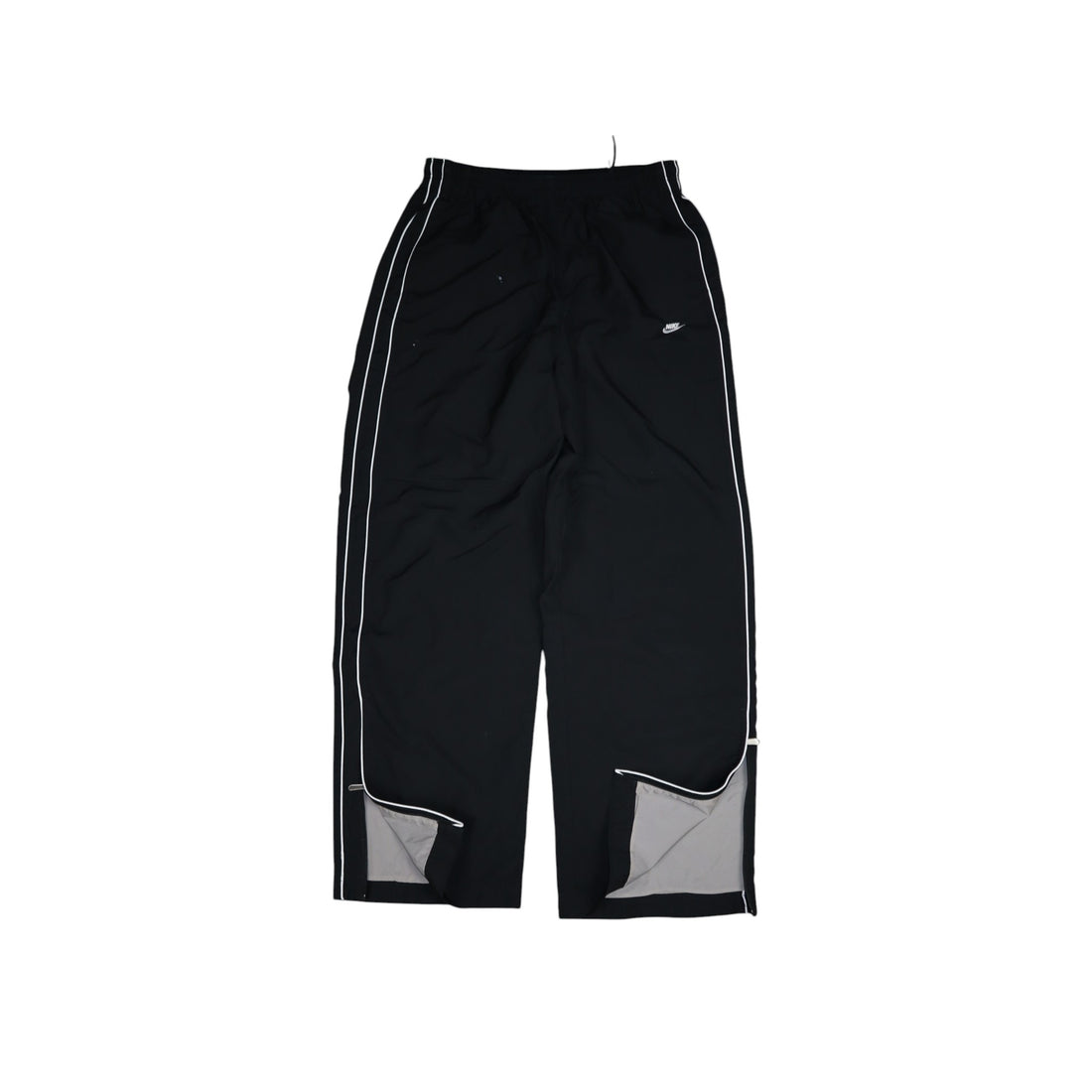 2000s Nike trackpants in black with white stripes — flat lay