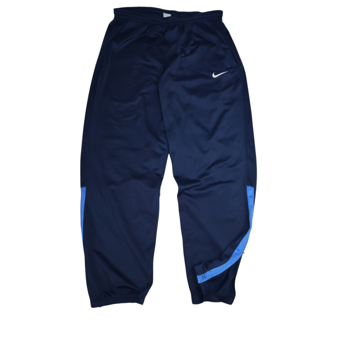 2000s Nike trackpants in navy with blue details — flat lay