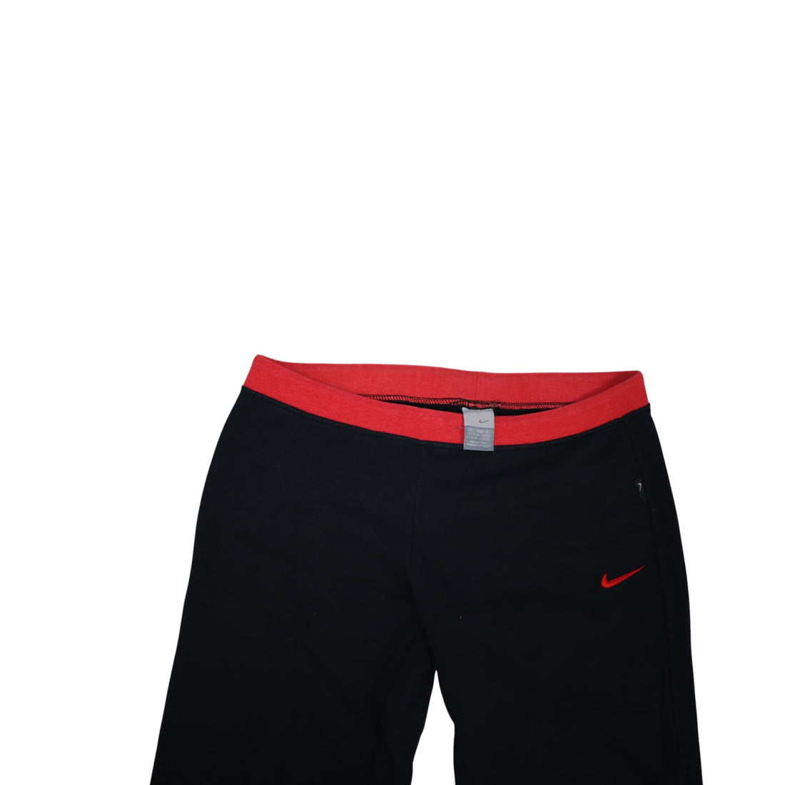 2000s Nike trackpants in black with red details — flat lay