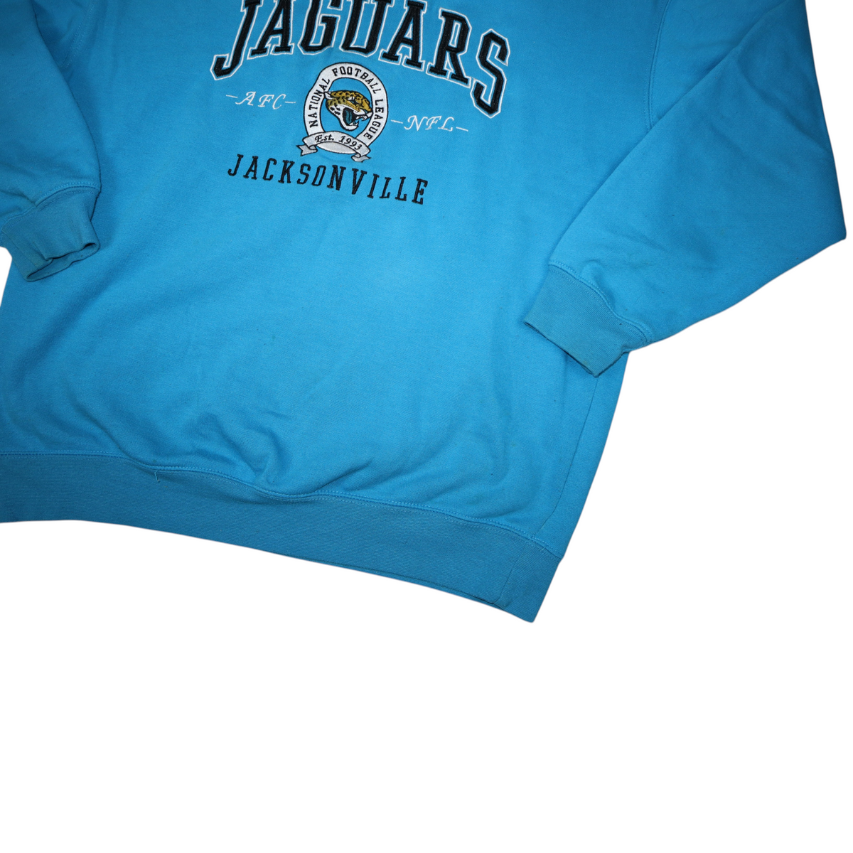 Gods Thrift Athens vintage teal Jacksonville Jaguars NFL crewneck sweatshirt with stitched logo and sleeve yellowing