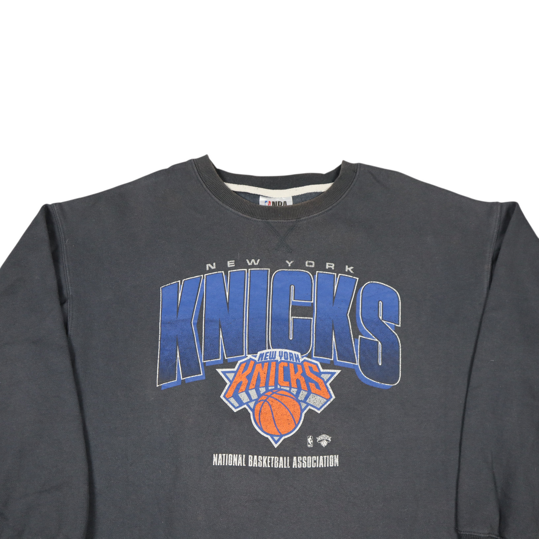 Gods Thrift Athens vintage dark grey New York Knicks crewneck sweatshirt with heritage team logo and NBA branding.